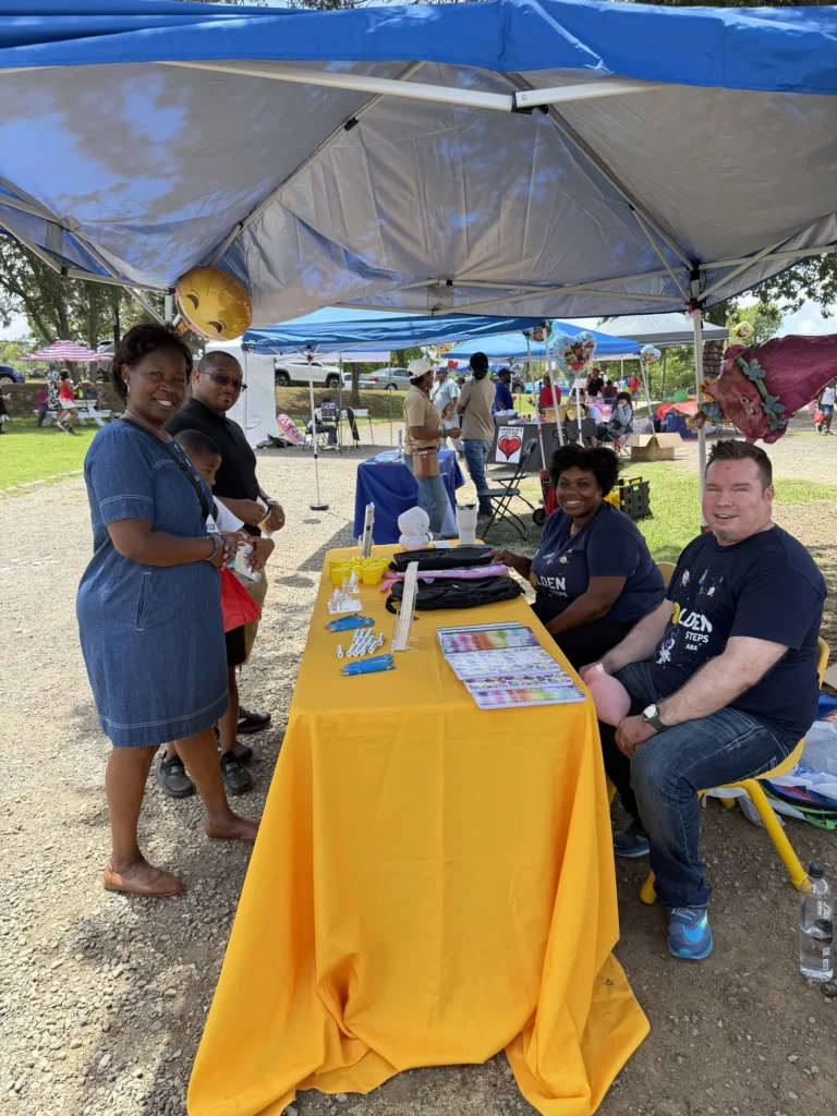 Families visit the Golden Steps ABA booth for backpacks and school supplies at the Know More Tears Back to School Carnival