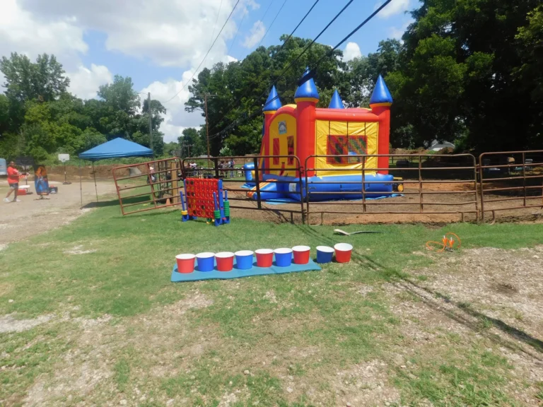 Lawn games and a bounce castle set out across the field