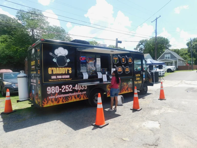 The G'Daddy's Soul Food Kitchen food truck serving families at the carnival