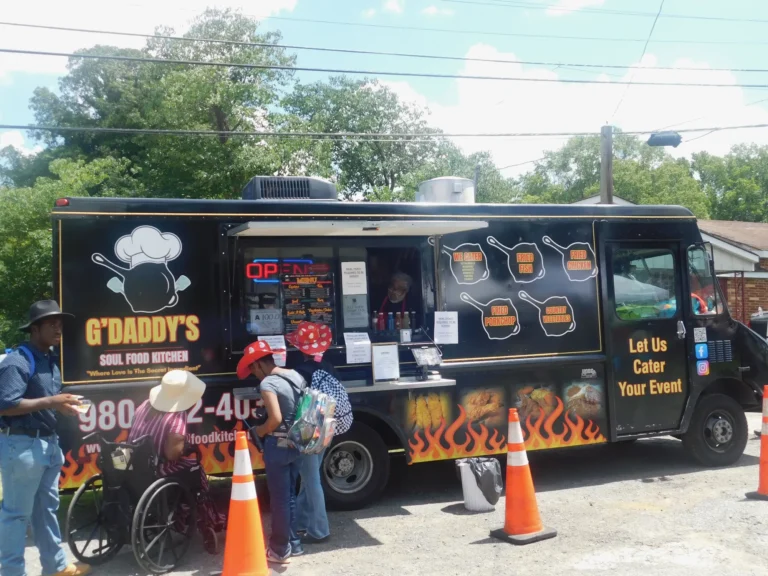 Families queue at the G'Daddy's Soul Food Kitchen truck