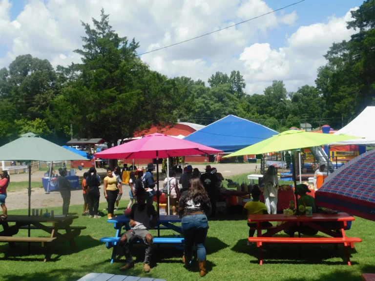 Bright canopies and picnic tables fill the carnival field