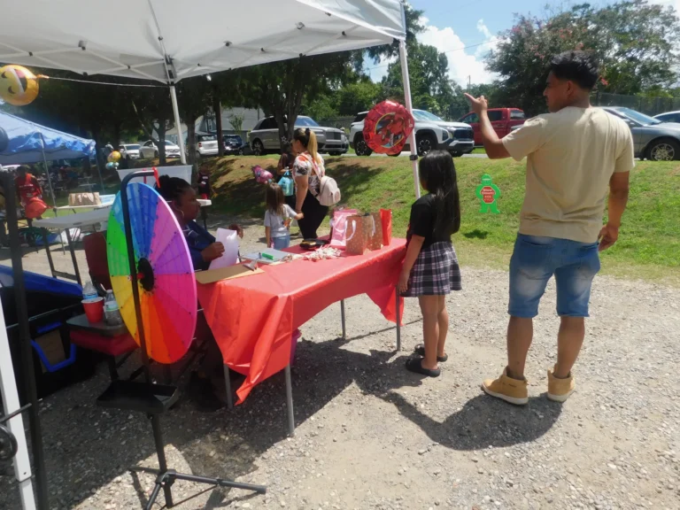Children line up to spin the prize wheel